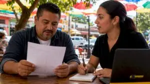 Customer reviewing car repair estimate with advisor