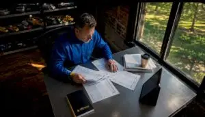 Fleet manager reviewing maintenance schedules in office