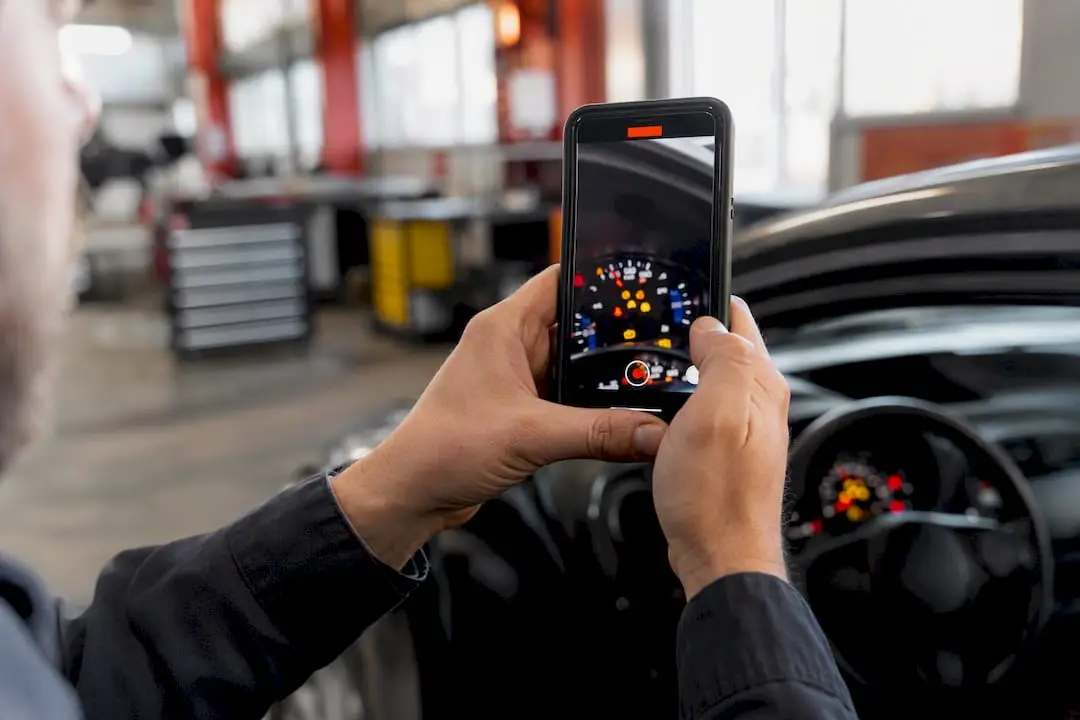 Hands recording car dash light flicker